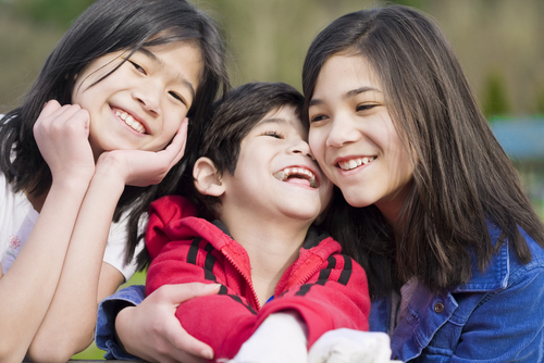 Two sisters and their disabled little brother