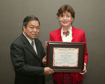 Board Member Dr. Long Pham with Justice Eileen Moore, 4th District Court of Appeals