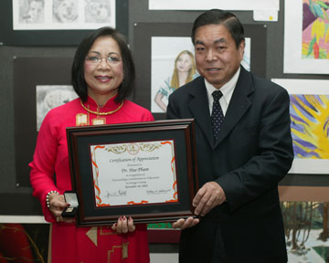 Dr. Hue Pham, Dean of Counseling and Special Services in the Coast Community College District with Board Member Dr. Long Pham